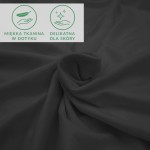 Prześcieradło jersey z elastanem w kolorze czarnym, rozłożone na płaskiej powierzchni. Materiał gładki i elastyczny, lekko zmarszczony. Widoczne ikony informacyjne: miękka tkanina w dotyku oraz delikatna dla skóry.