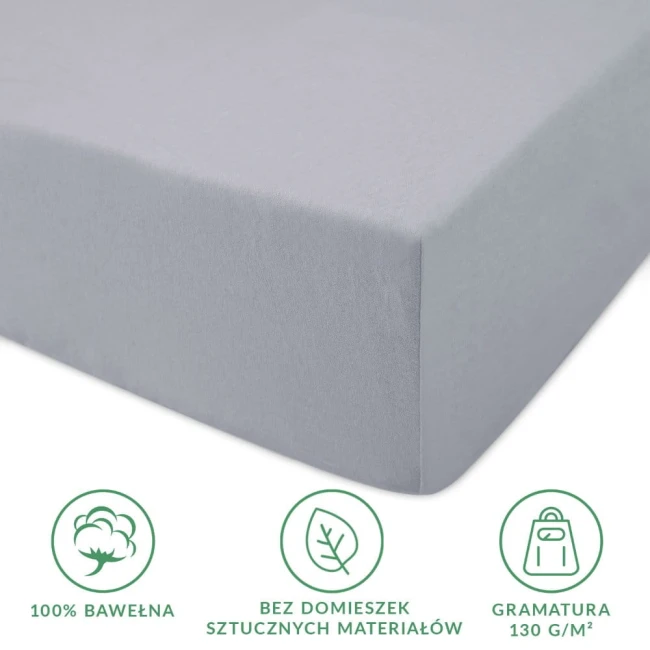 Prześcieradło jersey z gumką w kolorze popielatym, wykonane w 100% z bawełny, z gramaturą 130 g/m². Złożone, z gumką na brzegach, idealnie dopasowuje się do materaca 80x160 cm. Widoczna tekstura dzianiny, na białym tle, bez dodatkowych wzorów.