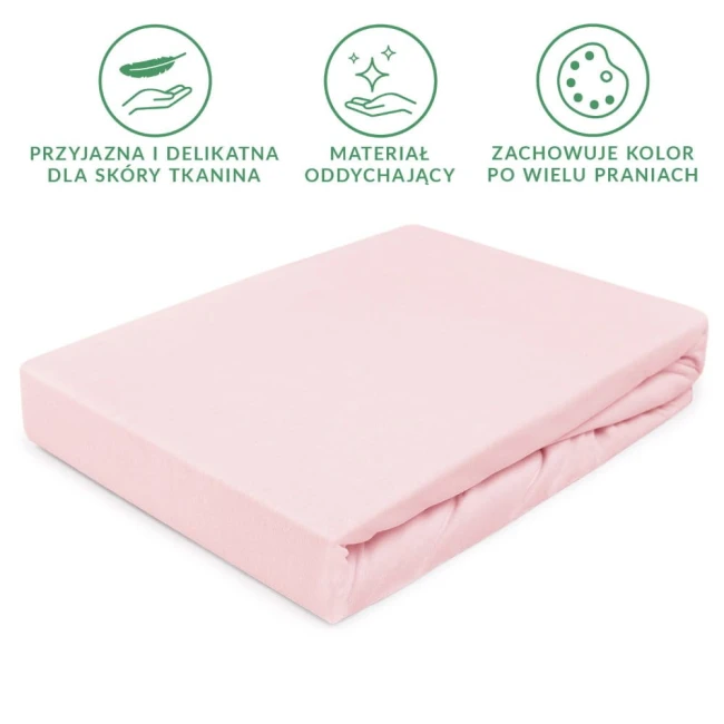 Prześcieradło jersey z gumką w kolorze różowym kwarcowym o wymiarach 180x200 cm, leżące na białym tle. Tkanina jest miękka i elastyczna, dobrze dopasowująca się do materaca. Widoczne zagięcia materiału, podkreślające jego fakturę.