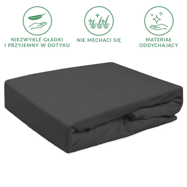 Prześcieradło frotte z gumką 90x200 w kolorze antracytowym, leżące na białym tle, z widoczną miękką fakturą materiału. Zgarniane z jednej strony, pokazujące gumkę na brzegach, zapewniające elastyczne dopasowanie do materaca.