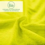 Prześcieradło frotte 180x200 w intensywnym, limonkowym kolorze, o teksturowanej powierzchni. Ułożone na płasko, ukazuje gładkie, elastyczne wykończenie z gumką, zapewniającą dopasowanie do materaca. Logo i napis są częściowo zasłonięte, nieczytelne.