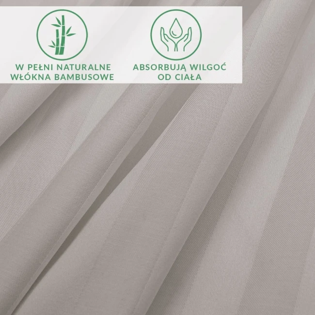 Prześcieradło bambusowe w odcieniach szarości, wykonane z satyny bawełnianej, z widoczną teksturą i delikatnymi paskami. Ułożone w sposób swobodny, ukazuje miękkość materiału.