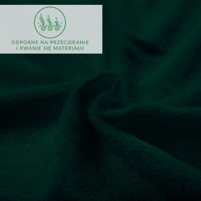 Prześcieradło frotte z gumką w kolorze zieleni butelkowej, o wymiarach 200x220 cm. Materiał z miękką, teksturowaną powierzchnią, odporny na przecieranie i rwanie. Delikatne fałdy materiału w zbliżeniu.