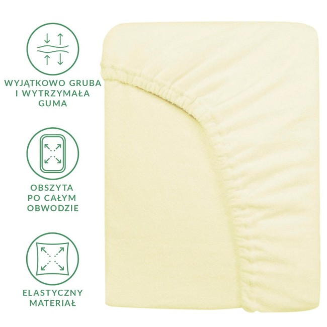Prześcieradło frotte z gumką 60x120 w kolorze kremowym, leżące na jednolitym tle. Widoczna elastyczna guma obsyta po całym obwodzie, materiał o delikatnej fakturze. Prosta forma, bez dodatkowych wzorów czy logo.