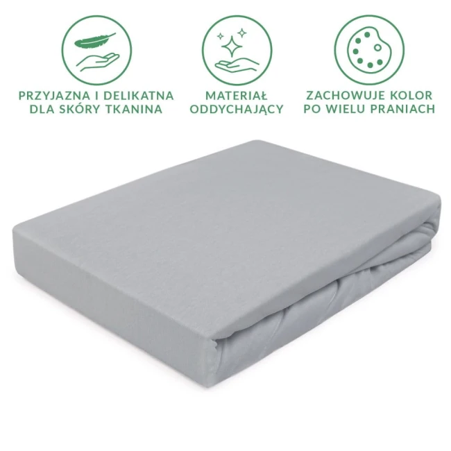 Prześcieradło jersey z gumką w kolorze popielatym, o wymiarach 200x220 cm, rozłożone na płaskiej powierzchni. Materiał oddychający, gładki, dobrze dopasowujący się do materaca. Brak widocznych napisów czy logo.