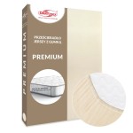 Prześcieradło jersey z gumką 140x200 w kolorze jasnego beżu. Ukazane z boku, na tle opakowania, z detalem widocznego materiału. Widać, że pasuje na materac o wysokości do 25 cm. Prosta grafika z widocznym logo i napisem PREMIUM.