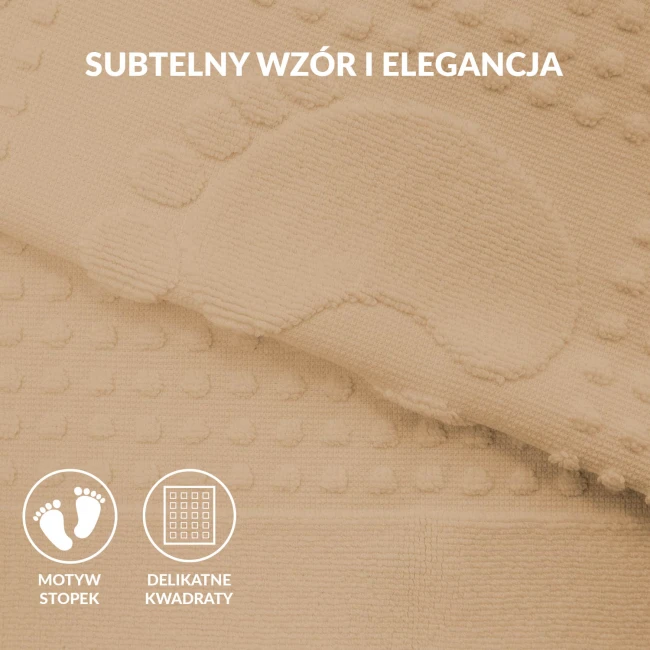 Dywanik łazienkowy 50x70 w kolorze cappuccino, leżący na płaskiej powierzchni. W widocznym obszarze wyraźny wzór w kształcie stóp oraz tekstura z wypukłymi kropeczkami. Materiał miękki, odpowiedni do użytku w łazience.