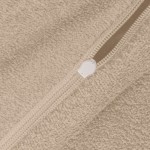 Poszewka frotte 80x80 cm w beżowym kolorze, o teksturowanej surface. Widoczny zamek błyskawiczny w kolorze białym. Ujęcie zbliżone, ukazujące detale materiału i zamka. Tło jasne, podkreślające fakturę produktu.