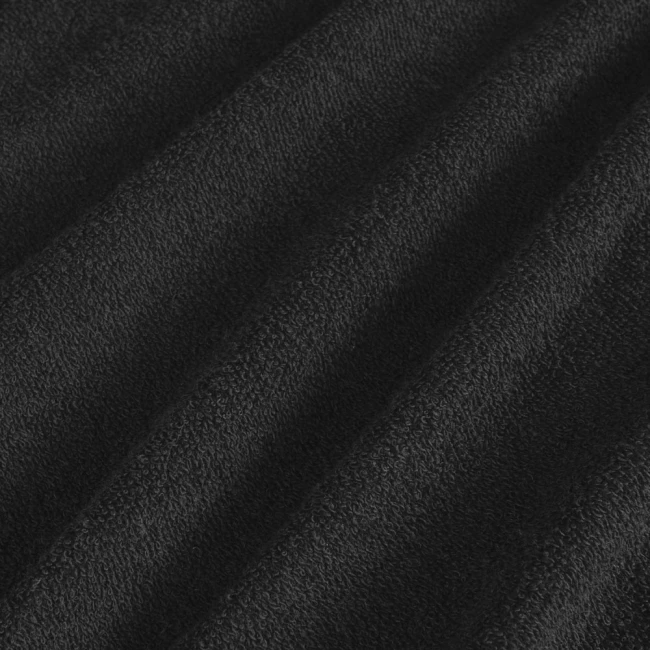 Poszewka frotte o wymiarach 40x80 cm w kolorze czarnym, wykonana z miękkiego materiału o teksturowanej powierzchni. Ułożona w sposób luźny, co podkreśla jej elastyczność i przyjemność w dotyku. Idealna do użytku na poduszki.