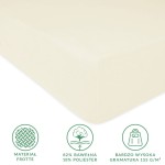 Prześcieradło frotte w kolorze ecru, o wymiarach 80x180 cm, wykonane z 82% bawełny i 18% poliestru. Widoczne jest w zbliżeniu, z wyraźną fakturą i elastyczną gumką. Tło neutralne. Logo oraz detale dotyczące materiałów i gramatury umieszczone obok.